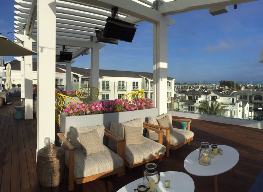 Rooftop bar with views of city and gas heater